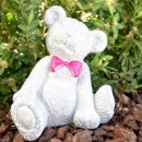 Teddy mit rosafarbener Schleife